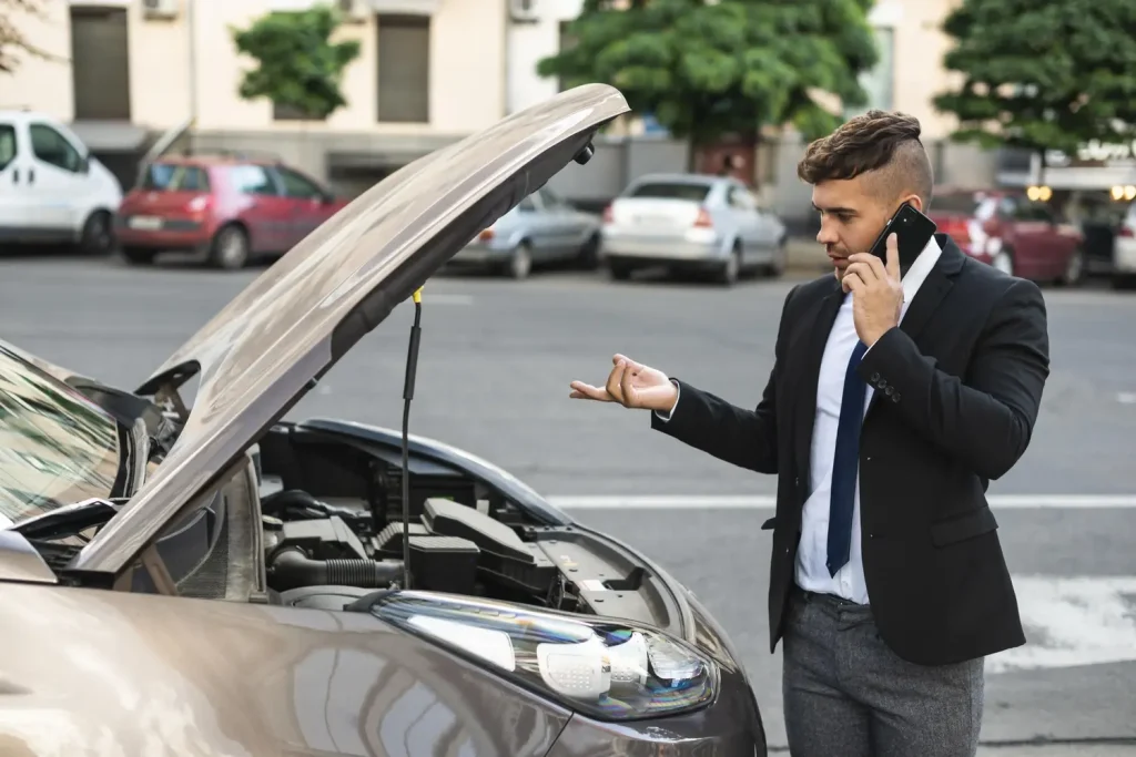 Man talking with car service, lemonlawassist