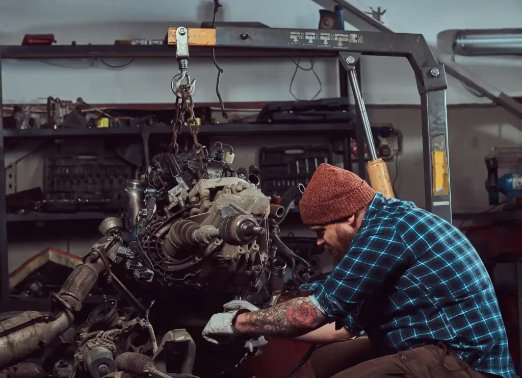 Mechanic specialist repairs the car engine,lemonlawassist