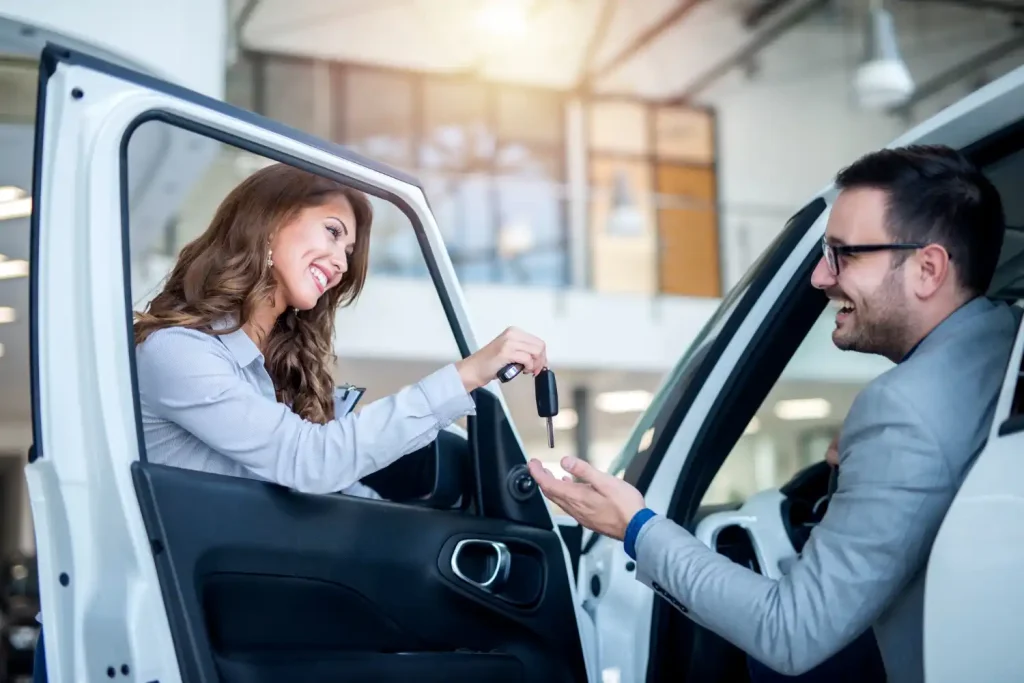customer at vehicle showroom choosing new car,lemonlawassist