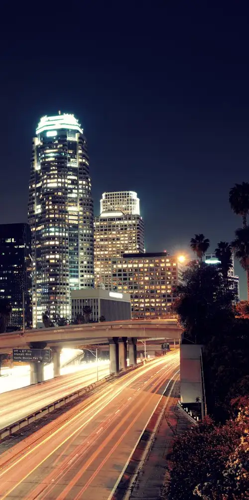 Cars driving in night in downtown Los Angeles
