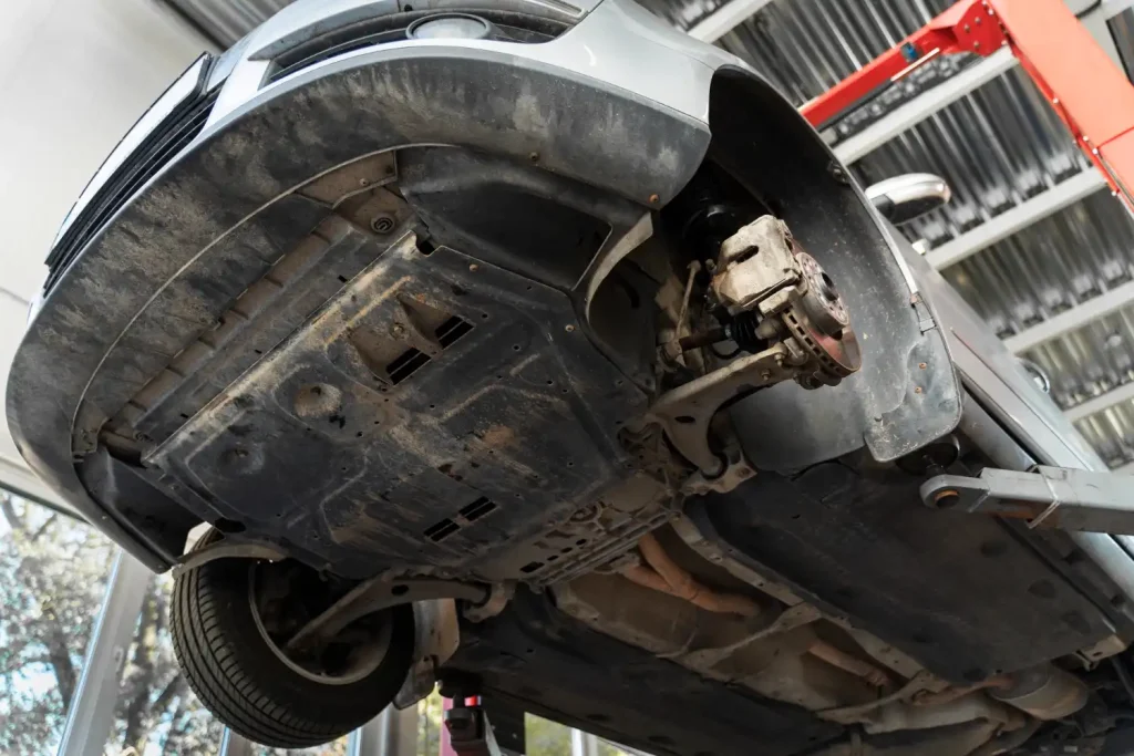 Low angle workshop repairing suspension, lemonlawassist