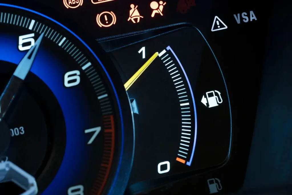 Close up on fuel level gauge in vehicle, lemonlawassist