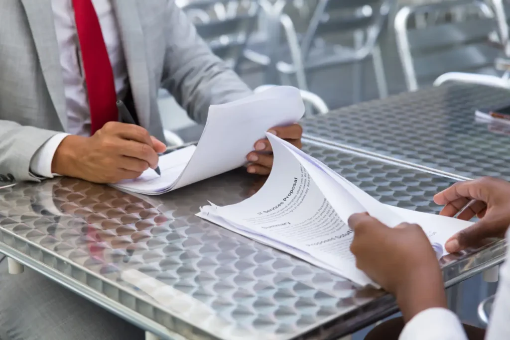 Man checking and signing document