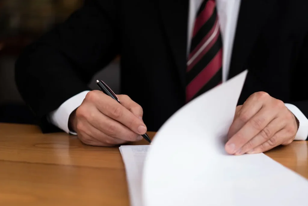 Attorney writing front view, lemonlawassist