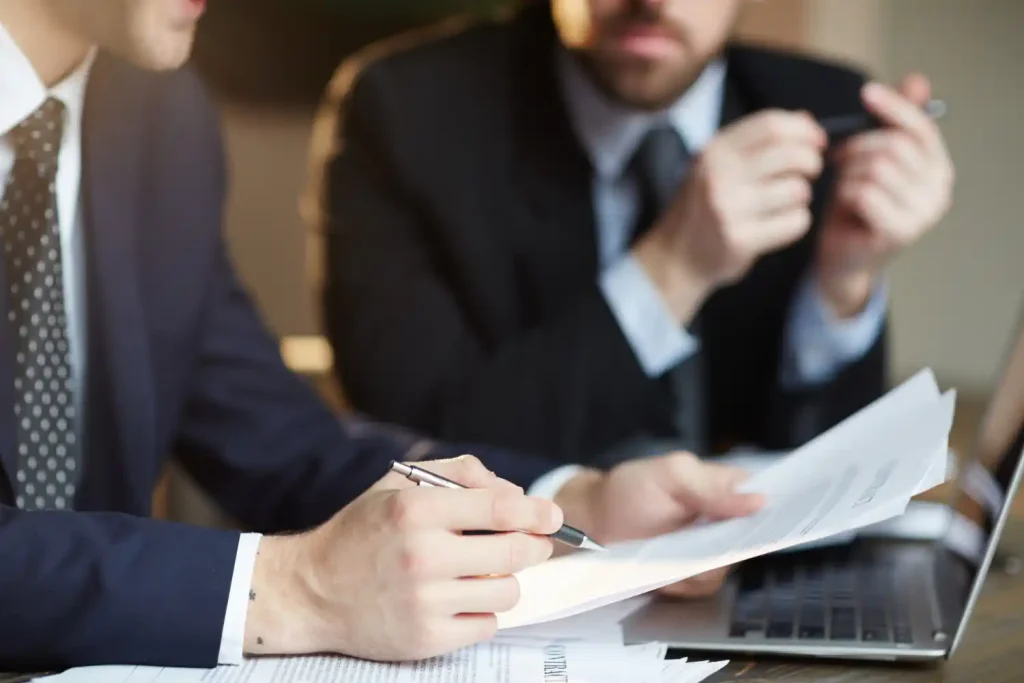 Lawyers and client Discussing Contract, lemonlawassist