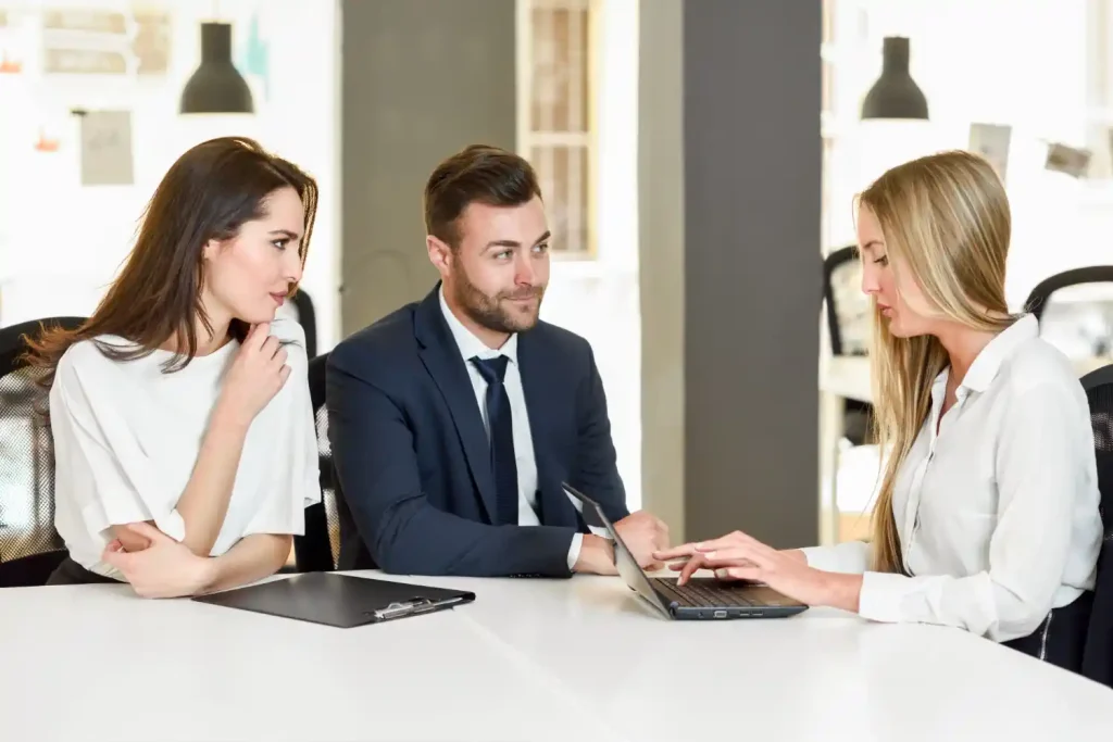 Lawyers meeting between two clients and a consultant in a modern office, lemonlawassist