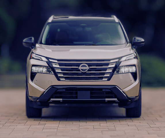 Front view of a sleek modern SUV with a bold grille design, lemonlawassist