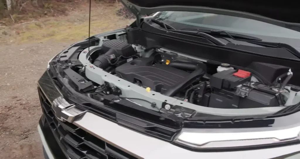 Chevrolet engine bay with hood open, showing engine components, lemonlawassist